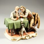 A GOOD CAPODIMONTE PORCELAIN GROUP, two men sitting at a table, a chicken on the table, a dog by