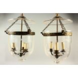 A GOOD PAIR OF CUT GLASS HANGING CHANDELIERS, the glass dome etched with wheat ears, enclosing three