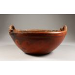A LARGE PERUVIAN POTTERY CIRCULAR TWO-HANDLED BOWL, with wavy and zigzag pattern, signed CHULUCANAS,