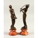 A PAIR OF ART NOUVEAU STYLE BRONZES OF YOUNG LADIES, on marble bases. 21cms high.