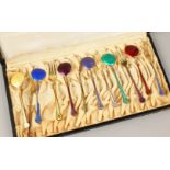 O. H. RASMUSSEN, A GOOD CASED SET OF SIX SILVER AND ENAMEL SPOONS AND FORKS.