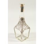 A STERLING SILVER MOUNTED GLASS DECANTER AND STOPPER. 27cm high.