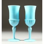 A PAIR OF PALE BLUE GLASS GOBLETS. 21cm high.