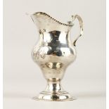 A GEORGE III CREAM JUG. Engraved R.L.R. London 1780. Maker: T.S.