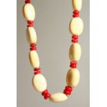 A LARGE BONE AND CORAL NECKLACE.