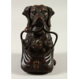 A BLACK FOREST STYLE CARVED WOOD DOG WITH PUPS INKWELL. 13cms high.