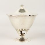 A GOOD HAMMERED SILVER CIRCULAR CUP AND COVER. 12.5cms high.