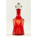 A RUBY GLASS DECANTER AND STOPPER. 26cm high.