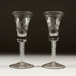 A PAIR OF WINE GLASSES, with inverted bell shaped bowls, etched with roses with opaque white air