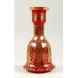A GOOD BOHEMIAN RUBY AND GILT DECORATED BELL SHAPED DECANTER. 27cm high.