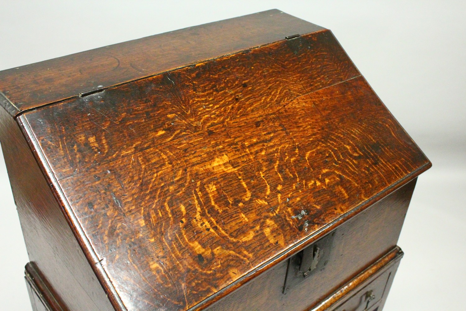 AN 19TH CENTURY OAK DESK ON STAND, with sloping front, fitted interior with small drawers, on a - Image 2 of 19