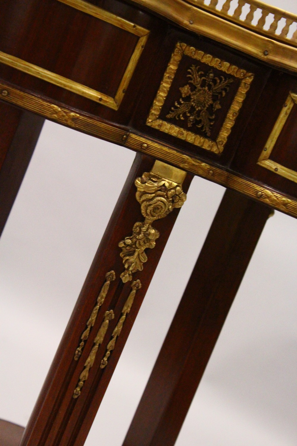 A FRENCH STYLE MAHOGANY, ORMOLU AND MARBLE TWO TIER TREFOIL SHAPE TABLE. 55cm wide x 75cm high. - Image 3 of 6