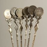 SIX CHINESE WHITE METAL COIN SPOONS. 16cms long.