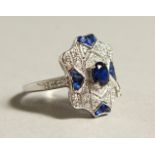 A SILVER AND BLUE PASTE DECO STYLE RING.