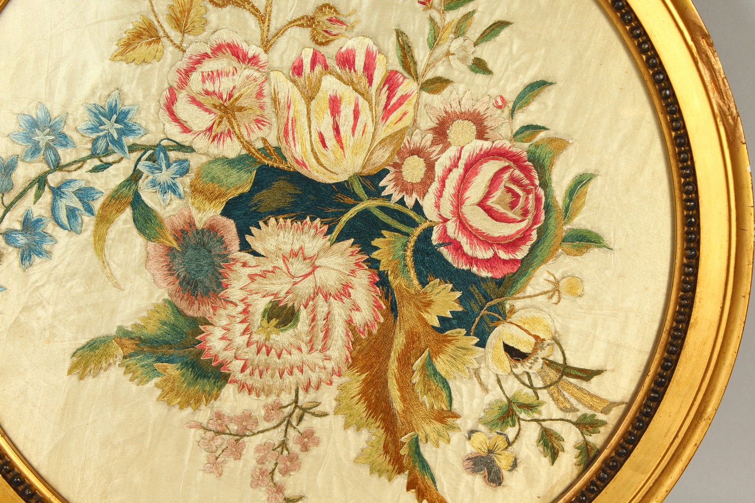 A FRAMED AND GLAZED BRUSSELS OVAL SILKWORK FLOWER.. 34cms diameter. - Image 2 of 3