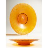 A WMF MYRA KRYSTAL CIRCULAR ORANGE GLASS DISH. 31cm diameter.