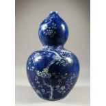 A LARGE DOUBLE GOURD VASE, decorated with a cherry blossom tree. 38cms high.