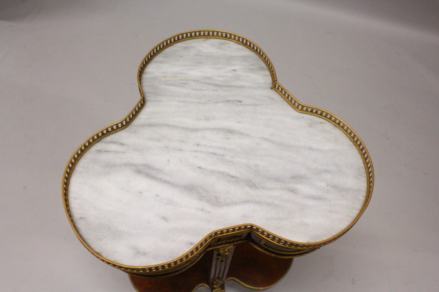 A FRENCH STYLE MAHOGANY, ORMOLU AND MARBLE TWO TIER TREFOIL SHAPE TABLE. 55cm wide x 75cm high. - Image 6 of 6