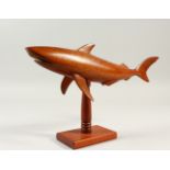 A PITCAIRN ISLAND CARVED WOOD MODEL OF A SHARK, on a stand. 40cms long.