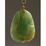 A CARVED JADEITE PEACH FORM PENDANT. 5.5cms high.