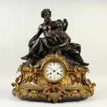 A 19TH CENTURY FRENCH ORMOLU AND SPELTER MANTLE CLOCK, mounted with a male and female figure, the