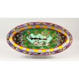 CLEMENTINA VAN DER WALT 1994. A LARGE OVAL DISH decorated with stars etc. 69cms long.