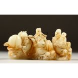 A CARVED WHITE JADE FIGURAL BRUSH REST. 16cms long.