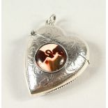 A SILVER HEART SHAPE VESTA, decorated with a nude.