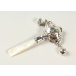 A SILVER AND MOTHER-OF-PEARL "BABY" RATTLE.
