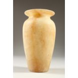 AN EGYPTIAN ALABASTER VASE. 19cms high.