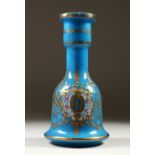 A GOOD CONTINENTAL BLUE BELL SHAPED DECANTER, with gilt decoration and white enamel. 27cm high.