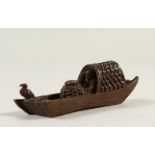 A BRONZE BOAT SHAPE JOSS STICK HOLDER. 9.5cms long.