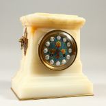 A GOOD 19TH CENTURY FRENCH ONYX AND CHAMPLEVE ENAMEL CLOCK, with enamel face and lion ring