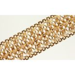 A LADIES 9CT GOLD FLEXIBLE BRACELET.