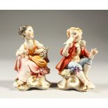 A SMALL PAIR OF CAPODIMONTE FIGURES OF A BOY AND GIRL. 11cm high.