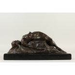 AN ABSTRACT BRONZE OF A RECLINING FEMALE NUDE, on a rectangular marble base. 33cms long.