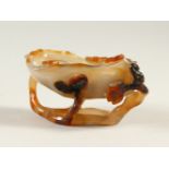 AN AGATE LOTUS FORM BRUSHWASHER. 9cms long.