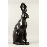 A LARGE BRONZE MODEL OF A SEATED HARE. 60cms high.