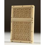 A SMALL PIERCED IVORY CARD CASE. 8cms high.