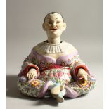 A MEISSEN STYLE "NODDING CHINAMAN" SEATED FIGURE, possibly by Samson of Paris (A.F.). 24cms high.