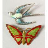 AN ENAMEL BUFFALO BROOCH and A SWALLOW BROOCH.