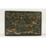 A CHINESE CARVED GREEN CINNABAR LACQUER BOX, figures in a landscape. 15cms wide.