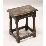 A 18TH CENTURY OAK JOINT STOOL ON TURNED LEGS. 48cm wide x 55cm high.