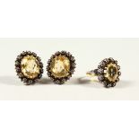 A GOOD PAIR OF CITRINE EAR CLIPS and MATCHING RING.