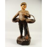 A LARGE AUSTRIAN POTTERY FIGURE OF A BOY, carrying two baskets. 78cm high.