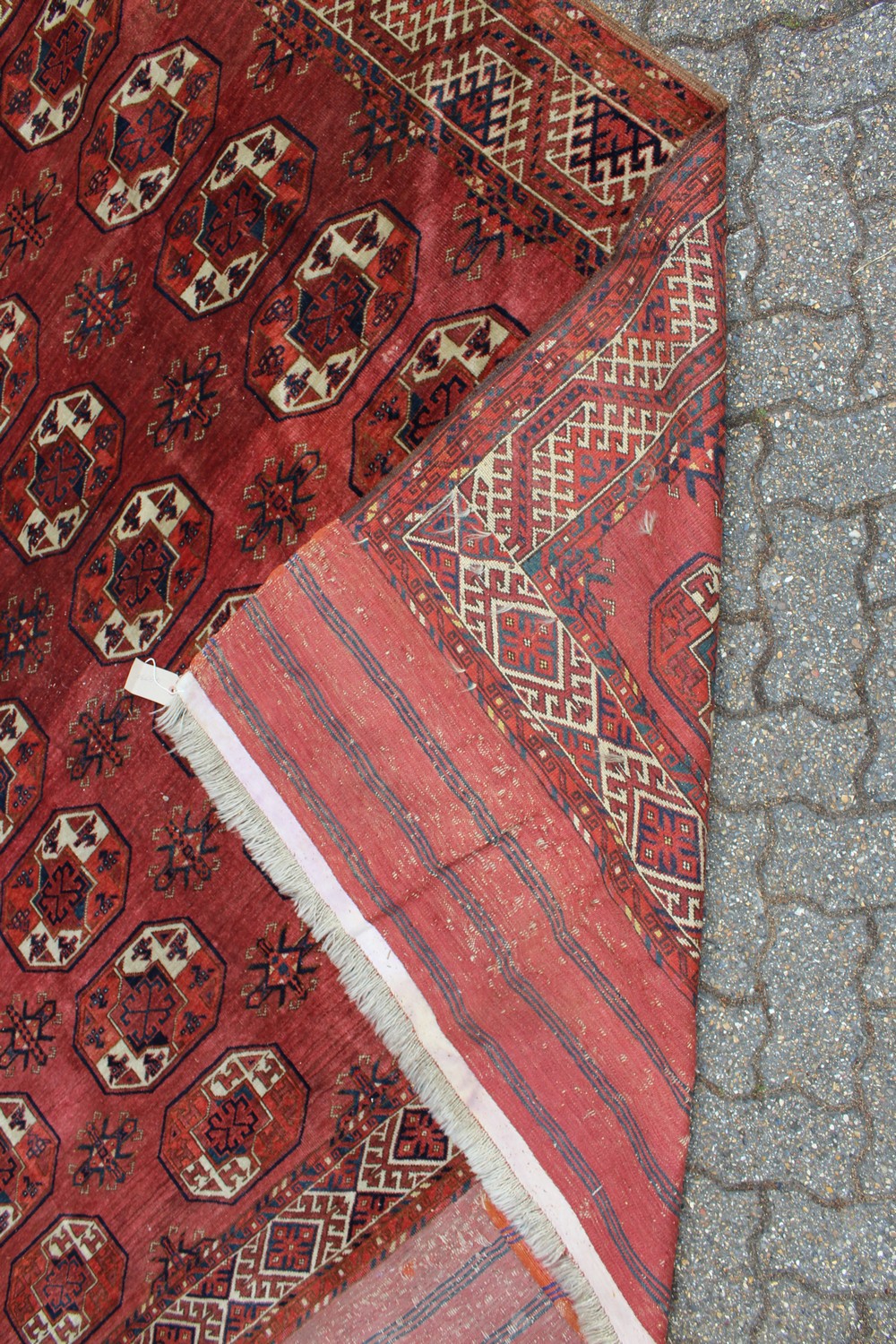 A LARGE TEKKE BOKHARA RUG, rust ground with four rows of eleven gulls, and broad end fringe. 135cm x - Image 9 of 10