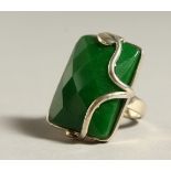 A SILVER AND JADE RING.