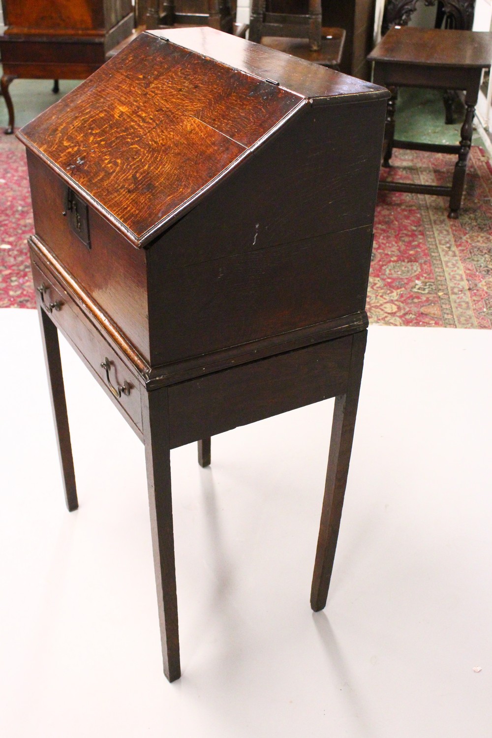 AN 19TH CENTURY OAK DESK ON STAND, with sloping front, fitted interior with small drawers, on a - Image 7 of 19