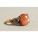 AN 18CT GOLD STONE AND DIAMOND RING.