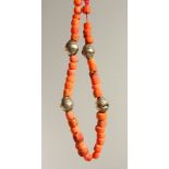 A CORAL AND METAL NECKLACE.